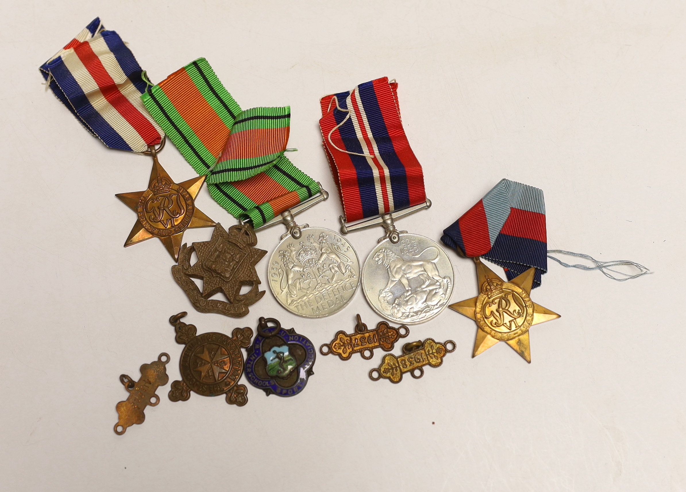 Four WW2 medals- the Defence Medal, the War medal, the 1939-1945 Star and the France & Germany Star and other minor items.